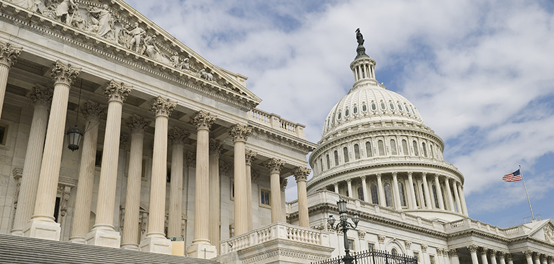 Panoramic view of a portion of the United States Capitol Building with American flag